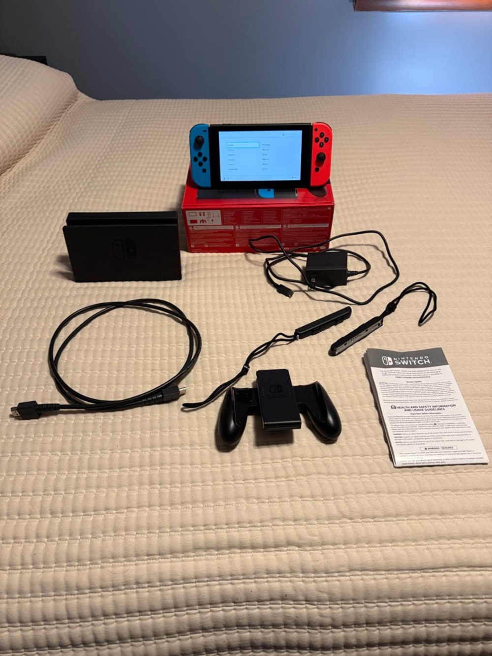 Nintendo Switch with Neon Blue & Neon Red Joy‑Con and Accessories